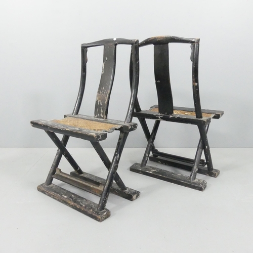 2036 - An antique pair of Chinese black lacquered folding chair, with hardwood frames and woven seats. Over... 