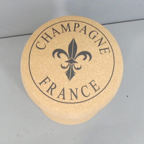 2037 - A contemporary champaign cork design stool. 34x51cm.