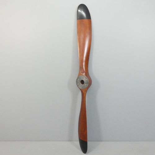 2041 - A large stained wood propeller, Length 197cm.