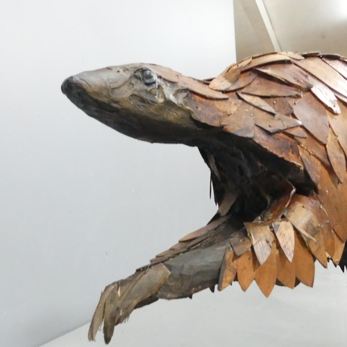 2054 - CLIVE FREDRIKSSON - A hand carved sculpture, study of a pangolin. 85x50x25cm.