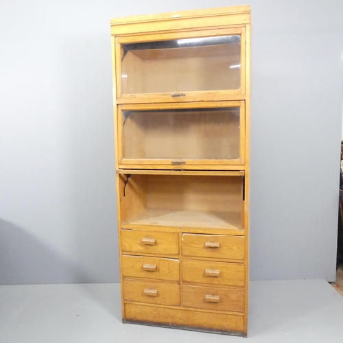 2063 - An early/mid 20th century oak haberdashery shop cabinet, made by Dudley & Co. Ltd., Showcase Manufac... 