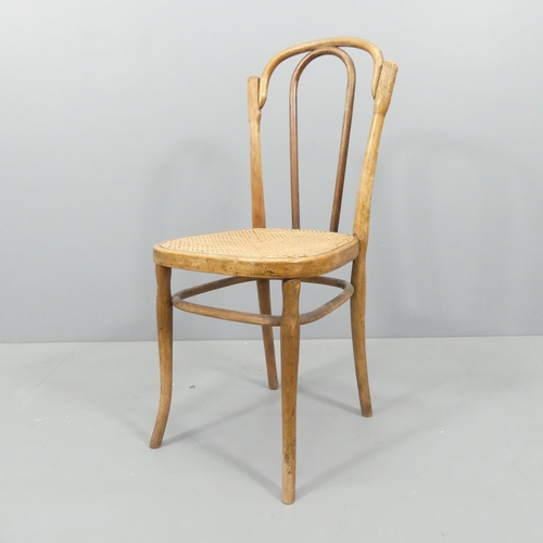 2070 - J & J Kohn - A model NR80 bentwood easy chair, with cane seat and maker's impressed mark beneath.