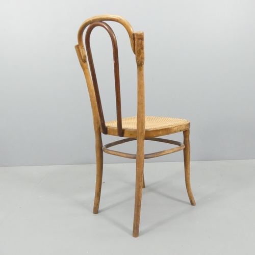 2070 - J & J Kohn - A model NR80 bentwood easy chair, with cane seat and maker's impressed mark beneath.