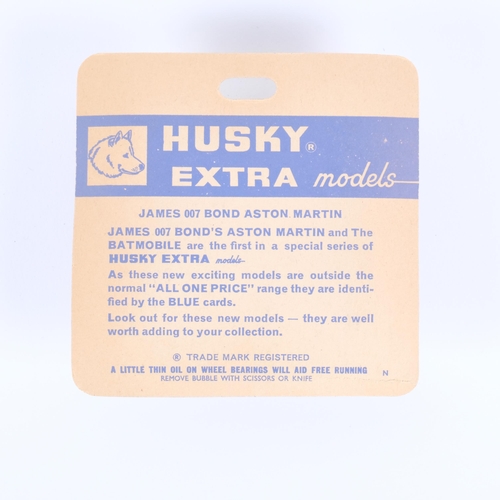 6 - A Husky Extra, model no. 1401, James Bond 007 Aston Martin vehicle, with ejector seat and associated... 