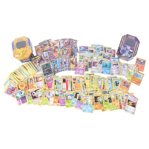 70 - POKEMON - a quantity of Pokemon trading card game loose cards, in associated collector's tins