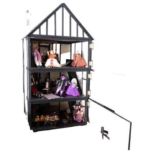 71 - An impressive hand-built Tudor style doll's house, over 3 floors, and including associated doll's ho... 