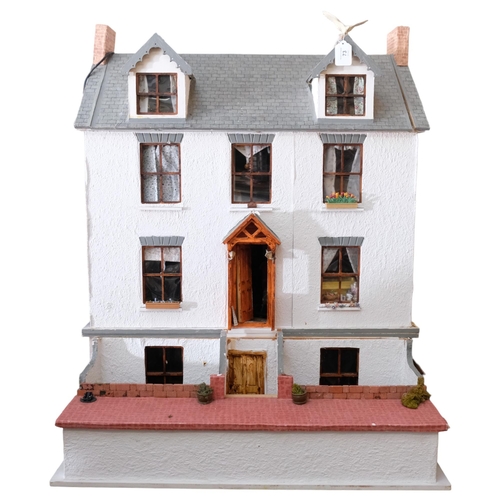 73 - A large and impressive hand-built doll's house, Victorian style townhouse spread over 4 levels, with... 