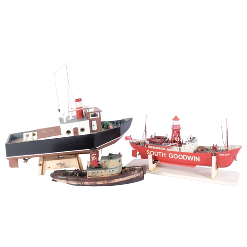 86 - A hand-built wooden pond yacht on associated wooden display stand, L45cm, and a hand-built lightship... 