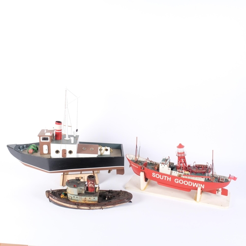 86 - A hand-built wooden pond yacht on associated wooden display stand, L45cm, and a hand-built lightship... 