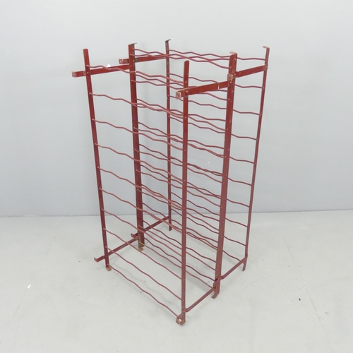 2682 - A pair of painted metal wire-work bottle racks. 54x100x50cm.