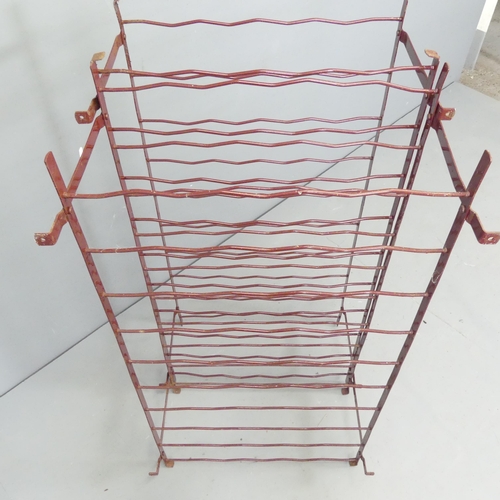 2682 - A pair of painted metal wire-work bottle racks. 54x100x50cm.