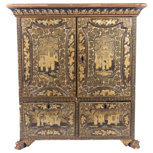 156 - A Chinese black lacquered table-top cabinet, with 2 panel doors revealing a cubby hole fitted interi... 