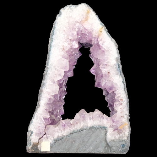 157 - A large amethyst geode, an archway in design, H30cm