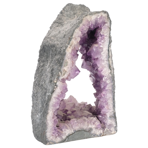 157 - A large amethyst geode, an archway in design, H30cm