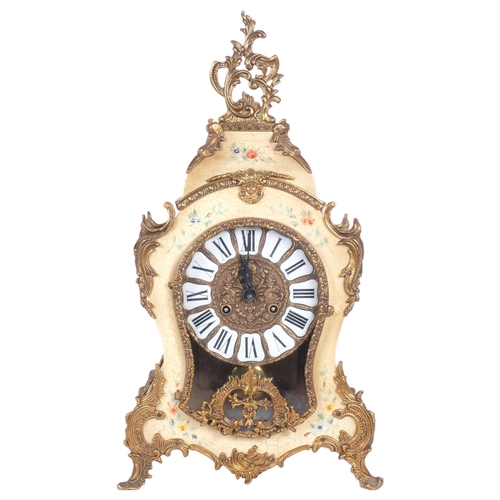 178 - A French mantel clock of shaped form, circular brass dial with enamel shields and Roman numerals, or... 