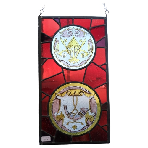 185 - A rectangular coloured leadlight glass panel with 2 circular roundels, depicting a hunting horn, 56c... 