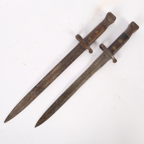 193 - 2 similar early 20th century military bayonets, 1 marked Sanderson Sheffield, L42cm, marks to the ot... 