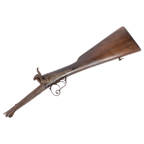 198 - A 19th century double-barrel percussion part rifle, comprising stock trigger and hammers, L56cm