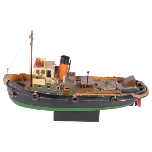 200 - An early 20th century scratch-built model of a harbour tug boat (Merseyside II), and stand, boat len... 