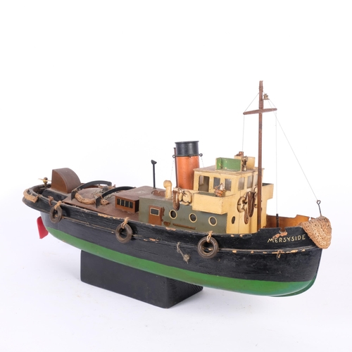 200 - An early 20th century scratch-built model of a harbour tug boat (Merseyside II), and stand, boat len... 