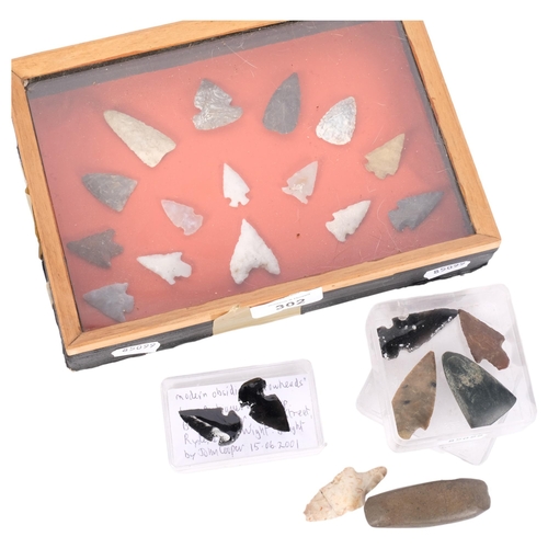 302 - A cased collection of Mesolithic arrowheads, 2 obsidian arrowheads (modern), and a collection of oth... 