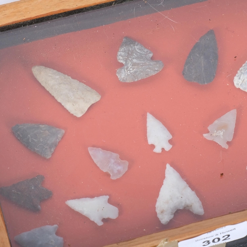 302 - A cased collection of Mesolithic arrowheads, 2 obsidian arrowheads (modern), and a collection of oth... 