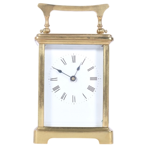 311 - A brass-cased carriage clock, case height not including handle 11cm