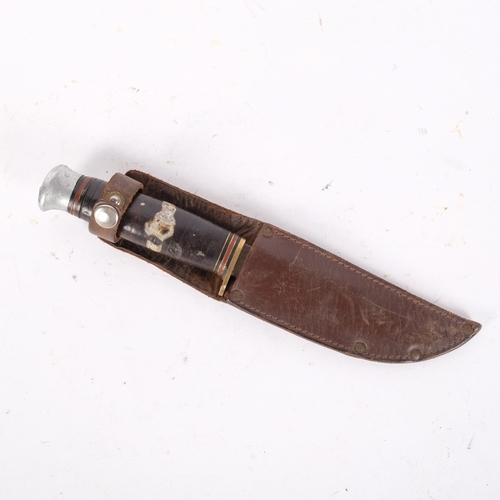 318 - A barrel handled hunting knife, by William Rogers, Sheffield England (tip missing), with leather she... 