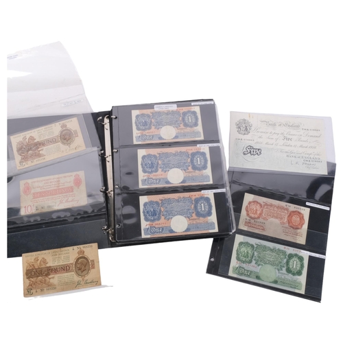 331 - An album of United Kingdom banknotes, including 2 white £5 notes, £1 notes from circa 1930, 1940, 19... 