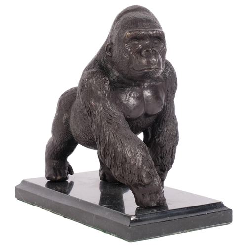 353 - A bronze sculpture of a gorilla, on a marbled base, H18.5cm