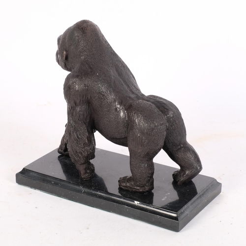 353 - A bronze sculpture of a gorilla, on a marbled base, H18.5cm