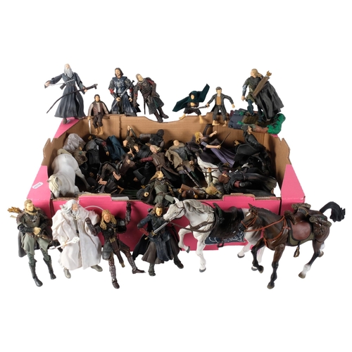 107 - LORD OF THE RINGS - a large quantity of loose action figures associated with the Lord of the Rings f... 