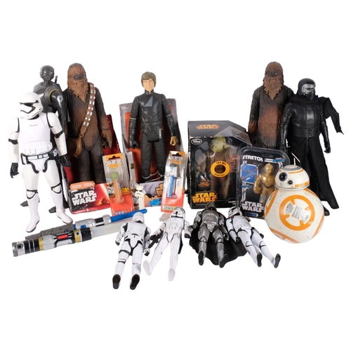 140 - STAR WARS - a group of figures toys and other items associated with the film franchise, including a ... 