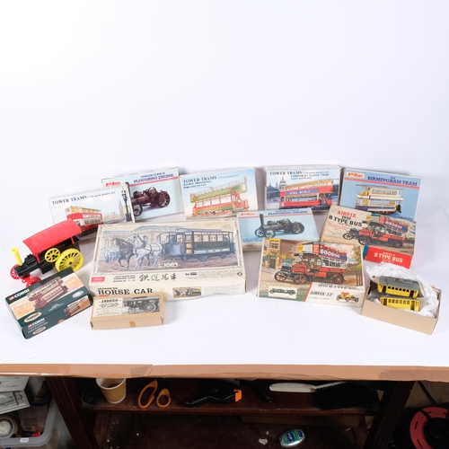 143 - A group of plastic model display kits, including an Airfix 32 scale 1910 E-type bus, several Keilkra... 