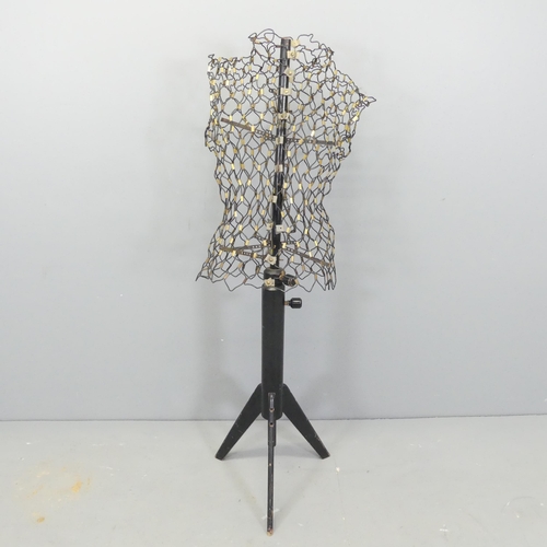 2671 - A mid-century French adjustable wire mannequin on ebonised tripod stand, labelled 