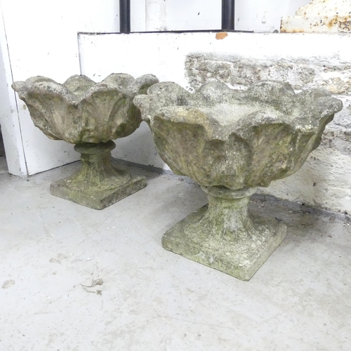 2672 - A pair of weathered concrete garden urns. 44x36cm.