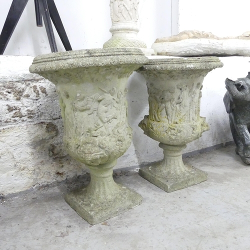 2673 - A pair of weathered concrete garden urns. 35x48cm.