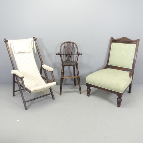 2688 - A teak framed campaign style folding chair, a child's high chair and a Victorian mahogany and uphols... 