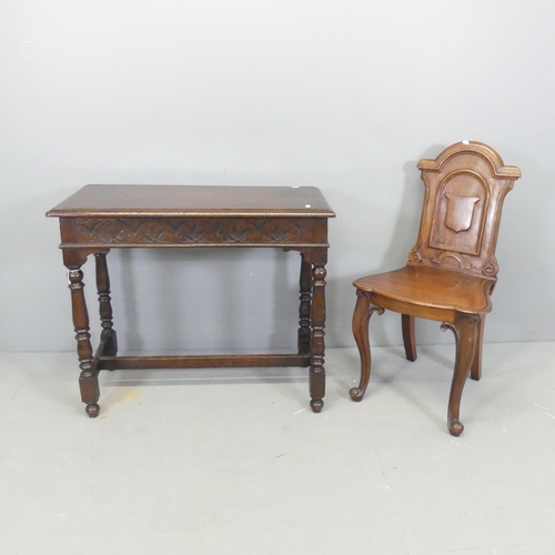 2690 - A Victorian mahogany shield back hall chair, and an antique carved oak hall table, 84x72x40cm. (2).