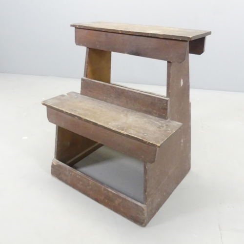 2695 - A Japanese stained kiri wood step stool, with three character marks to inside. 54x65x43cm.