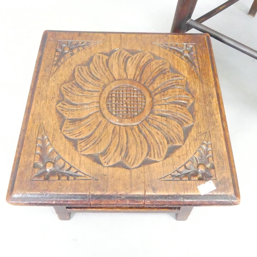 2696 - A Victorian Arts & Crafts oak open arm chair, and a carved oak footstool (2).