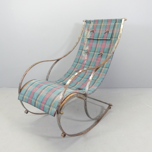 2699 - A steel and teak slatted rocking chair with sling seat, in the manner of R.W Winfield.