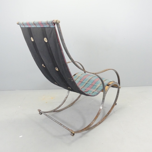 2699 - A steel and teak slatted rocking chair with sling seat, in the manner of R.W Winfield.