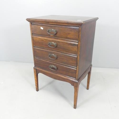 2700 - An early 20th century mahogany music cabinet, with drawer fitted interior containing various sheet m... 