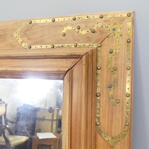 2702 - An Anglo-Indian design teak and brass mounted rectangular wall mirror. 90x129cm.