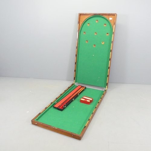 2703 - An antique mahogany cased folding Bagatelle game board, with cue and balls. Dimensions (folded) 122x... 