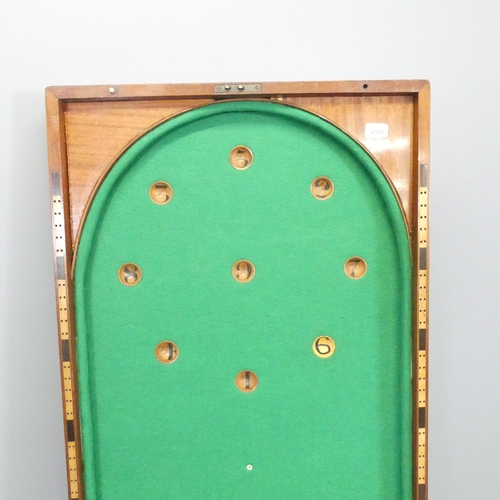 2703 - An antique mahogany cased folding Bagatelle game board, with cue and balls. Dimensions (folded) 122x... 