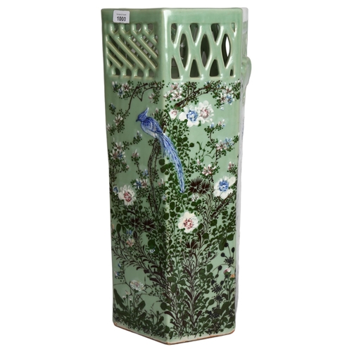 1000 - An Oriental design celadon octagonal stick stand, with bird and blossom tree decoration, H62cm