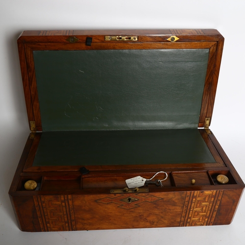 1010 - A Victorian walnut and specimen marquetry decorated writing slope, with 2 inkwells, W50cm