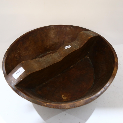 954 - An African carved wooden bowl with sectional divider, diameter 40cm